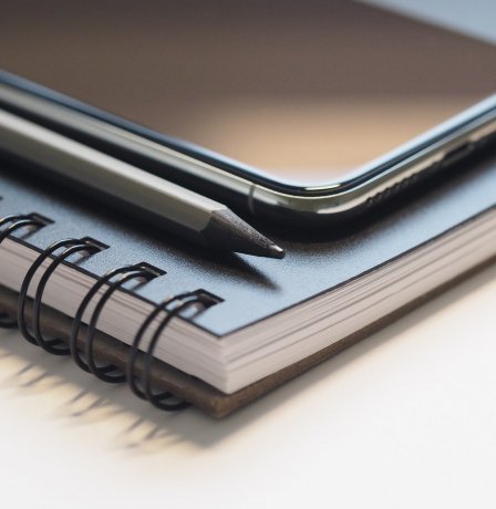 gallery/closeup-photo-of-black-smartphone-near-black-and-grey-pencil-768474
